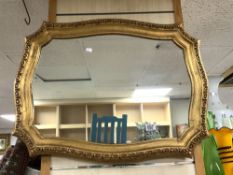 REPRODUCTION SHAPED GILT WALL MIRROR, 82X62 CMS.