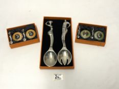 MOLTEN METAL DESIGN SALAD SERVERS IN BOX, AND TWO BOXED CONDIMENTS BY - ANDY C , SOUTH AFRICA.