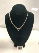 DIAMONDS SET IN PLATINUM CLASP IN A GRADUATED PEARL NECKLACE
