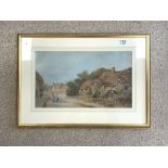 J MUIR WATERCOLOUR DRAWING - VILLAGE STREET SCENE WITH FIGURES AND COTTAGES SIGNED FRAMED AND GLAZED