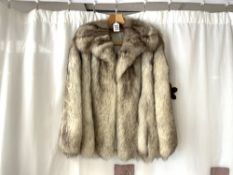 A WHITE AND BROWN FUR JACKET.