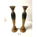 A PAIR OF PART PAINTED WOODEN TURNED CANDLESTICKS, 36 CMS.