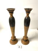 A PAIR OF PART PAINTED WOODEN TURNED CANDLESTICKS, 36 CMS.