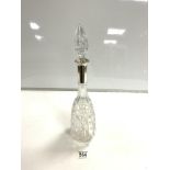 CUT GLASS DECANTER WITH HALLMARKED SIVER COLLAR.