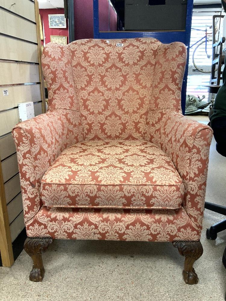 UPHOLSTERED WING BACK ARMCHAIR ON CARVED BALL AND CLAW FEET. - Image 2 of 2