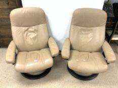 TWO LEATHER SWIVEL AND RECLINING STRESSLESS LOUNGE CHAIRS MADE BY EKORNES - NORWAY.