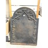 ANTIQUE IRON FIRE BACK WITH EMBOSSED CHERUB DECORATION, 51X71CMS.
