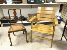 A FOLDING SLATED CONSERVATORY CHAIR, AND A CANE SEAT CHAIR.