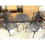 PAINTED METAL CIRCULAR GARDEN TABLE AND TWO MATCHING CHAIRS.
