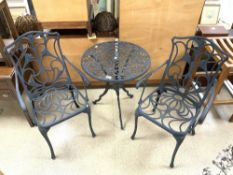 PAINTED METAL CIRCULAR GARDEN TABLE AND TWO MATCHING CHAIRS.
