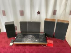 A BANG & OLUFSEN BEOCENTRE 2002, AND BANG & OLUFSEN RED LINE SPEAKER, AND THREE B&O BEOVOX -