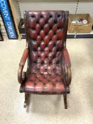 MAHOGANY AND BUTTONED RED LEATHER ROCKING CHAIR.