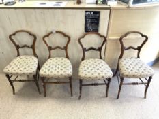 A SET OF FOUR VICTORIAN MAHOGANY SALON CHAIRS WITH SHAPED BACKS.