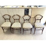 A SET OF FOUR VICTORIAN MAHOGANY SALON CHAIRS WITH SHAPED BACKS.