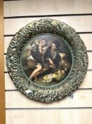 A PORTUGESE EMBOSSED PORCELAIN WALL PLATE, DECORATED WITH BOYS AND BASKET OF FRUIT, 42 CMS