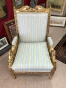 A FRENCH PAINTED GILTWOOD EMPIRE STYLE ARMCHAIR, WITH SWAN DECORATION ARM SUPPORTS.