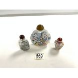 TWO CHINESE REVERSE PAINTED GLASS SNUFF BOTTLES, AND ONE PORCELAIN SNUFF BOTTLE.