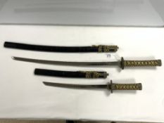 TWO REPRODUCTION SAMURI SWORDS.