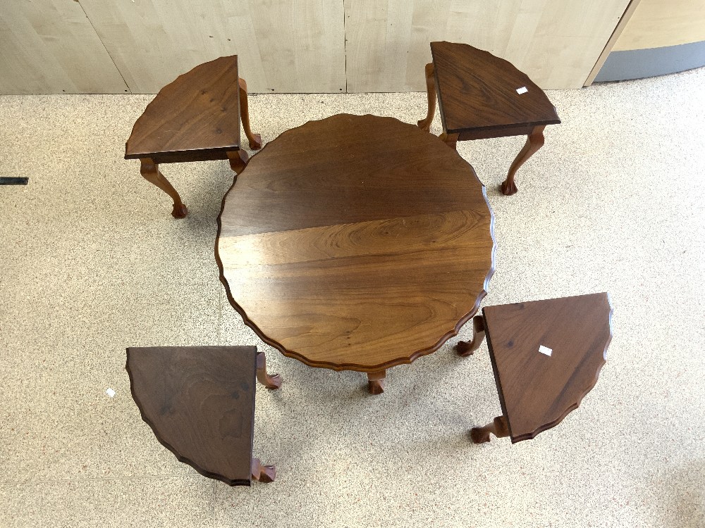 A WALNUT NEST OF SHAPED CIRCULAR TABLES ON BALL AND CLAW FEET, 68 CMS DIAMETER. - Image 3 of 3