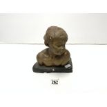 A GILT PAINTED PLASTER BUST OF A CHILD, 20 CMS.