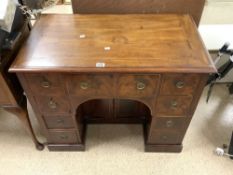 EARLY MAHOGANY WRITING DESK WITH NINE DRAWERS AND BOTTOM CUPBOARD DECORATED WITH BOX WOOD INLAY