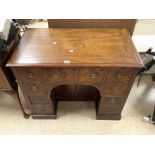 EARLY MAHOGANY WRITING DESK WITH NINE DRAWERS AND BOTTOM CUPBOARD DECORATED WITH BOX WOOD INLAY