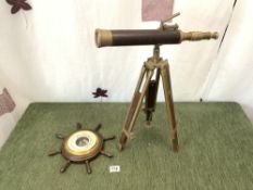 VINTAGE BRASS AND LEATHER TELESCOPE WITH A SHIPS WHEEL SHAPED BAROMETER