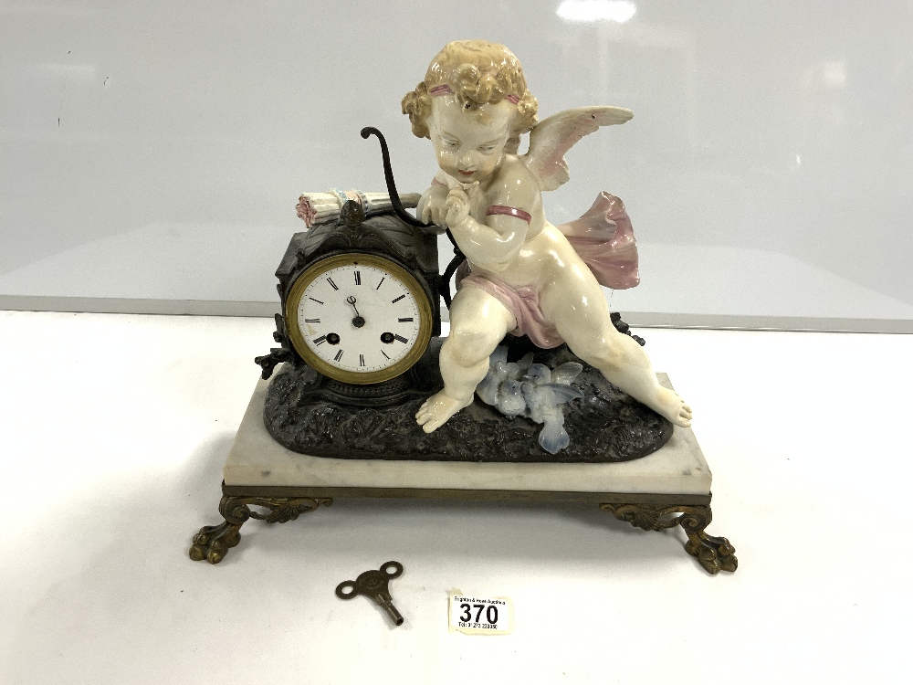 A 19TH-CENTURY FRENCH SPELTER AND GLAZED POTTERY MANTEL CLOCK WITH DRUM MOVEMENT, FLANKED BY A