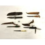 A VINTAGE MULTI PURPOSE DAGGER, MADE BY DECORA SELINGEN GERMANY, AND FOUR OTHER DAGGERS.