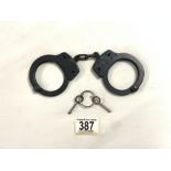 PAIR OF HANDCUFFS M - 100, MADE BY SMITH & WESSON - MADE IN USA.