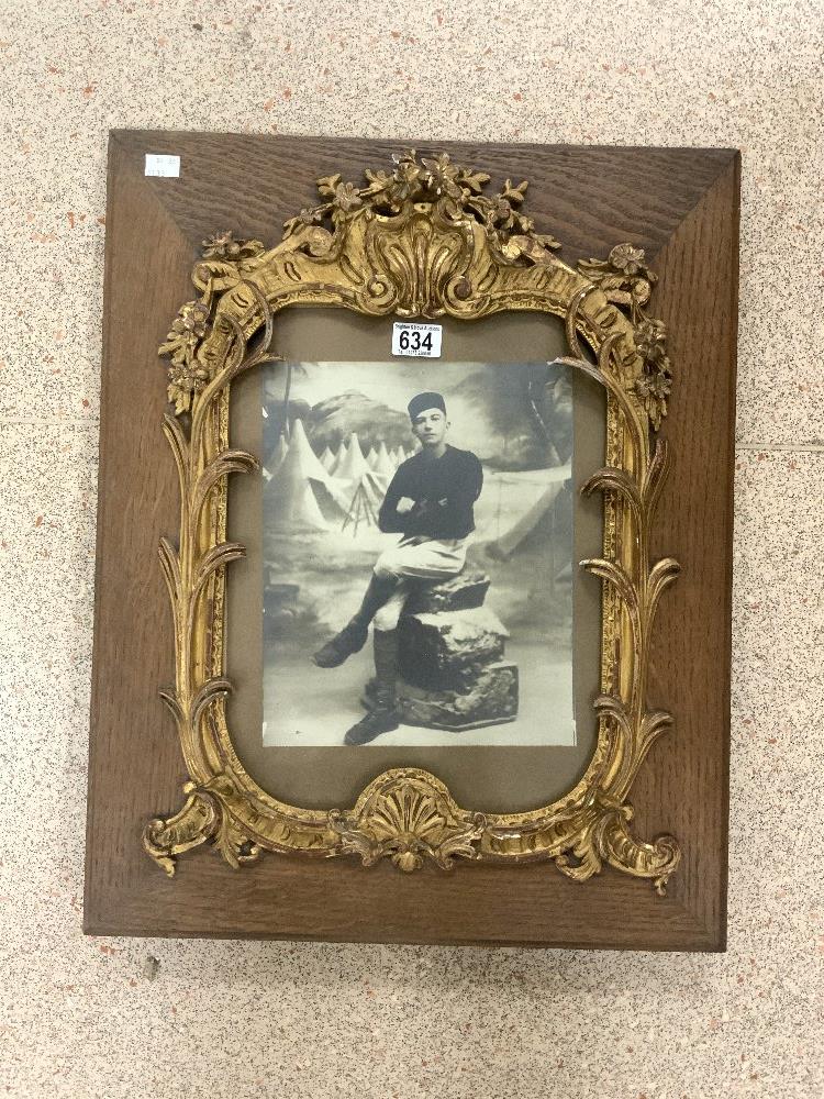 PHOTOGRAPH OF A SOLDIER IN OAK FRAME WITH ORNATE GILT SURROUND, 50X60 CMS.4