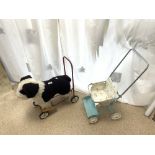 A VINTAGE NYLENA PUSH AND RIDE ALONG TOY DOG, AND A DOLLS PRAM.