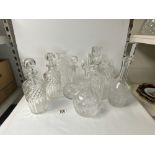 EIGHT VARIOUS CUT AND ETCHED GLASS DECANTERS, [ TWO WITHOUT STOPPERS ].