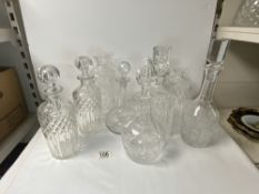 EIGHT VARIOUS CUT AND ETCHED GLASS DECANTERS, [ TWO WITHOUT STOPPERS ].