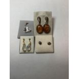 A PAIR OF SILVER AMBER SET EARRINGS, TWO OTHER PAIRS AND A CRYSTAL PENDANT.