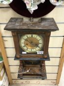 A GERMAN 19TH-CENTURY CARVED WALNUT WALL CLOCK WITH A WHITE ENAMEL DIAL, 87 CM.