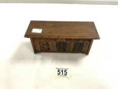 A MINATURE CARVED OAK DOLLS HOUSE COFFER, MADE BY - H UPHILL - WILTON. 20X8 CMS.