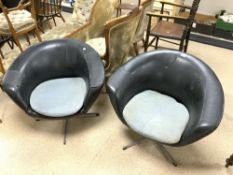 MID-CENTURY PAIR OF BLACK SWIVEL TUB CHAIRS ON METAL BASES A/F