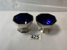 PAIR OF HALLMARKED SILVER OCTAGONAL PEDESTAL SALTS WITH BLUE GLASS LINERS, LONDON 1937, WILLIAM