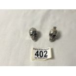 TWO WHITE METAL ARTICULATED SKULL PENDANTS, 41 GMS.