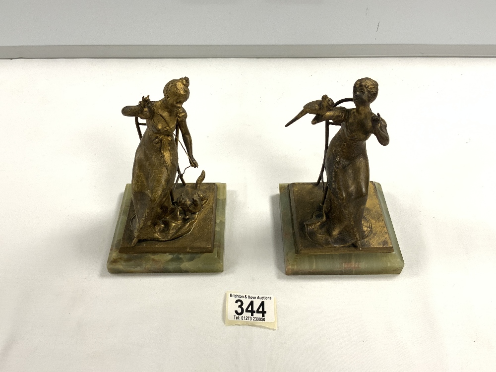 PAIR OF FRENCH GILT BRONZE LADY FIGURAL BOOKENDS ON ONYX BASES, 16 CMS. [ ONE WITH MISSING HAND ].