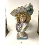 LARGE CONTINENTAL CERAMIC BUST OF A GIRL WEARING A FEATHERED HAT, A/F AND WITH REPAIRS, 64 CMS.