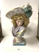 LARGE CONTINENTAL CERAMIC BUST OF A GIRL WEARING A FEATHERED HAT, A/F AND WITH REPAIRS, 64 CMS.