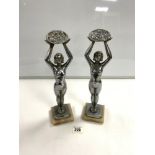 PAIR OF FRENCH ART DECO CHROME FIGURES OF LADIES HOLDING FLOWER BASKETS, ON MARBLE BASES, SIGNED