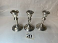 BROADWAY & CO THREE WEIGHTED HALLMARKED SILVER CANDLESTICKS DATED 1978 11CM