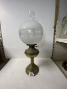 BRASS OIL LAMP WITH ETCHED GLASS SHADE.