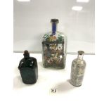 FOLK ART DIORAMA OF A MINING SCENE WOODEN FIGURE IN A GLASS BOTTLE ALSO WITH TWO OTHER BOTTLES