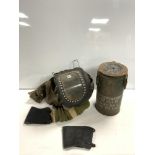 WORLD WAR II BABY GAS MASK, AND A MILITARY TIN DATED 1952.