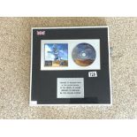 ROLLING STONES CD ALBUM BRIDGES TO BABYLON, FRAMED AND PRESENTED TO RECOGNISE SALES IN THE UK .