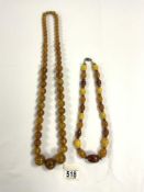 TWO AMBER COLOURED BEAD NECKLACES.